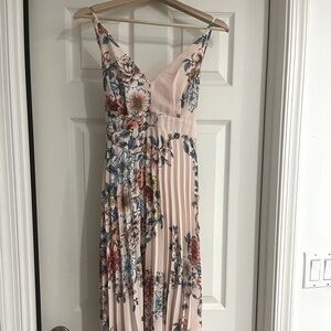 Crepe material, floral mid- calf sundress. Never worn